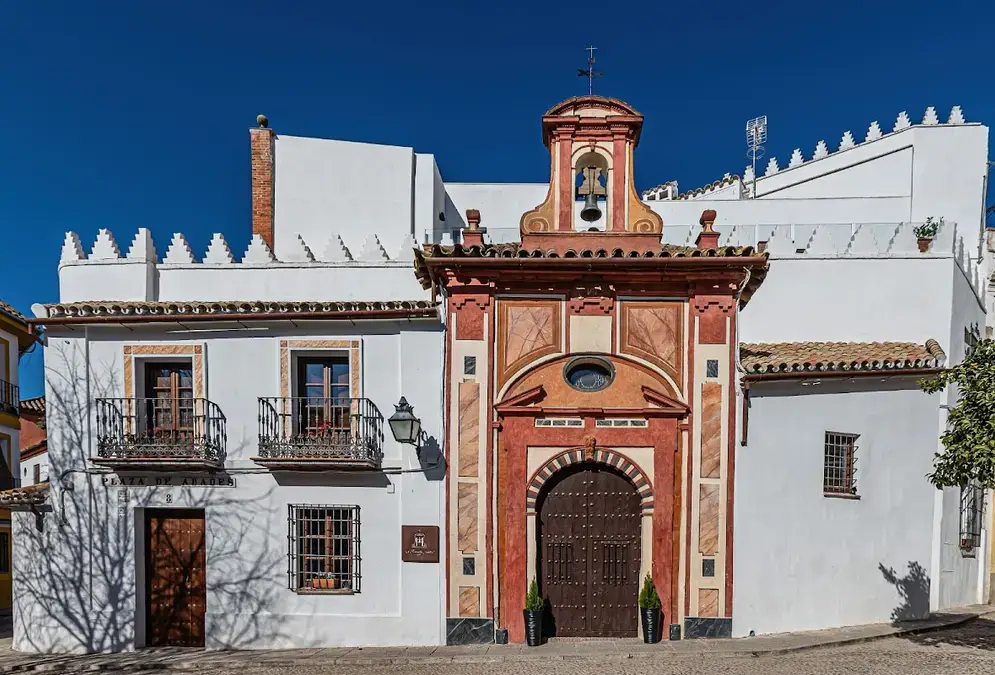 Caliphal arch in the inner courtyard of La Ermita Suites with Mezquita views
