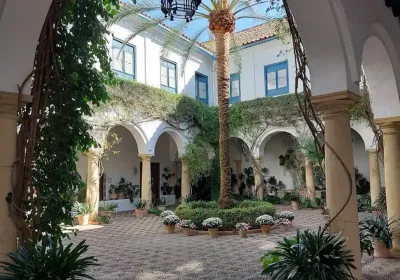 Courtyard of the Palacio de Viana with central marble fountain and orange trees